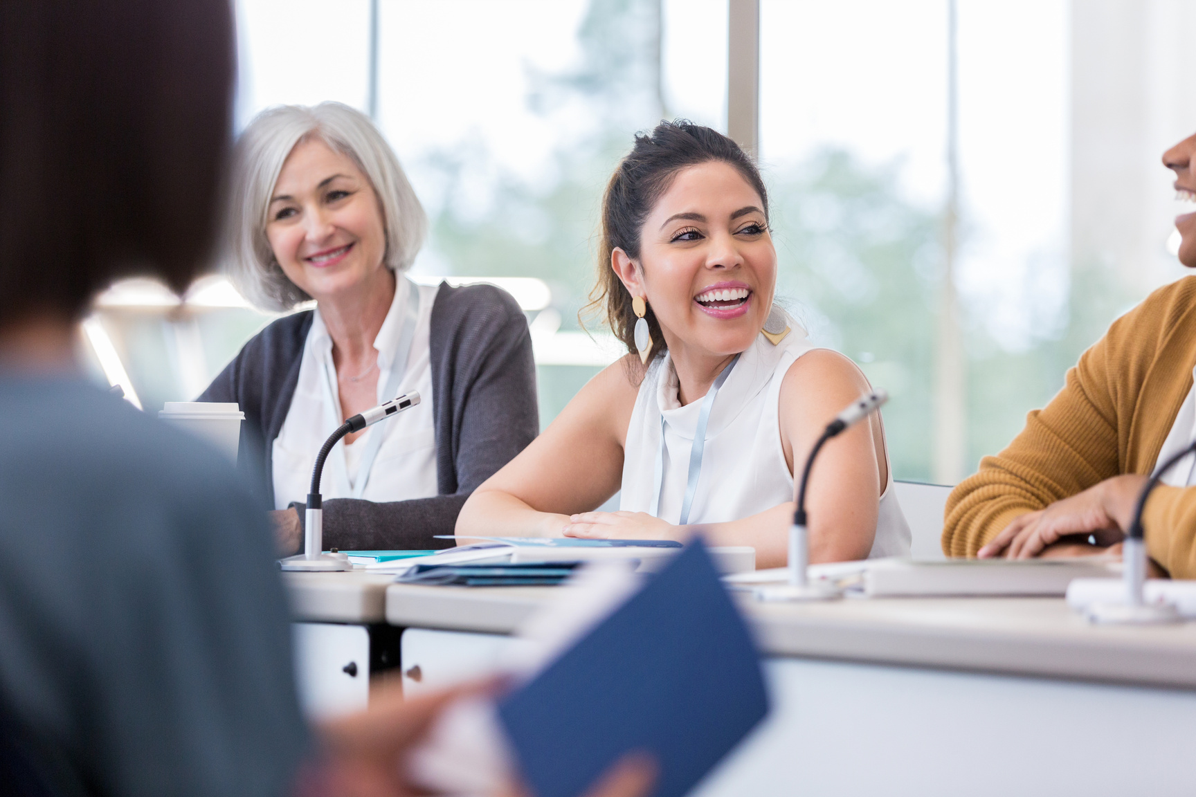 Cheerful panelist smiles during conference